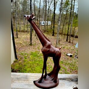 Elegant Brown Giraffe Sculpture measuring 16” tall at the head on a 6 1/2” base.